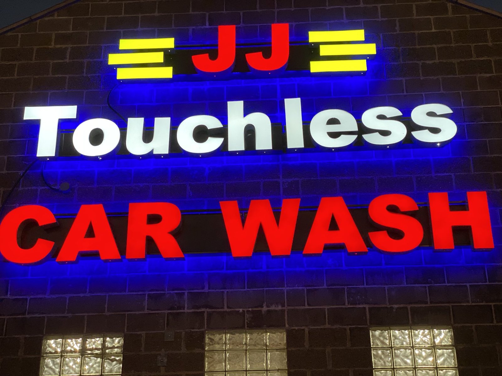JJ Touchless Car Wash illuminated channel letters at night