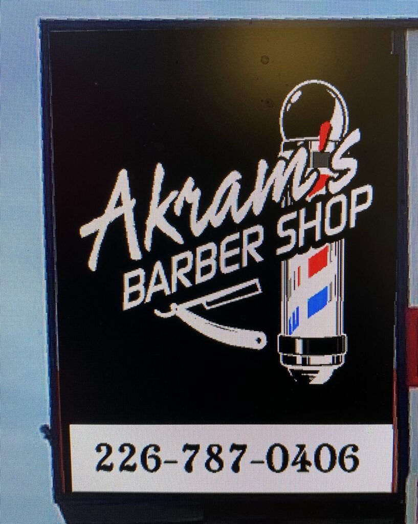 Akram's Barber Shop cabinet sign