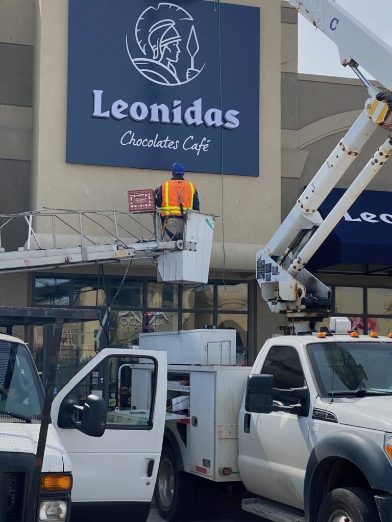 Leonidas Chocolates Café sign installation
