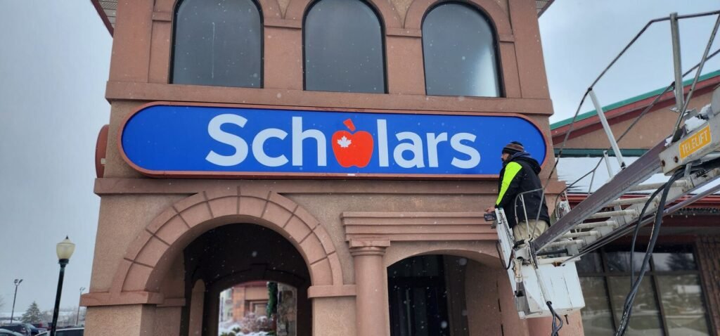 Scholars sign installation