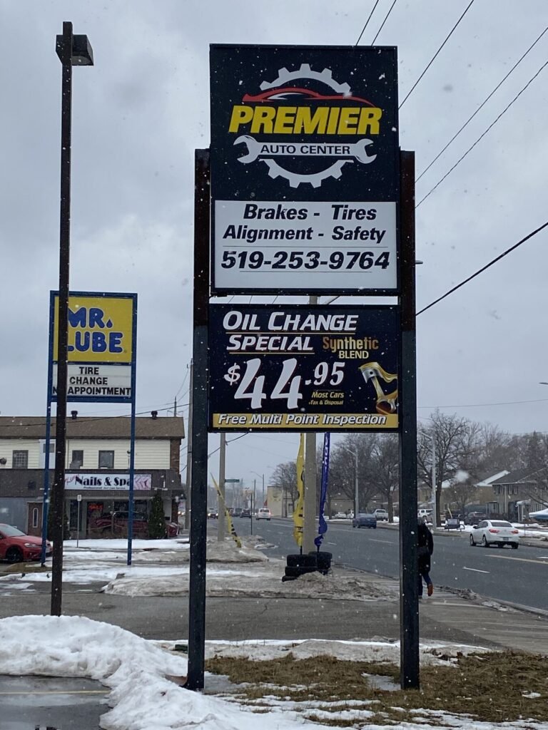Premier Auto Center pylon and monument sign